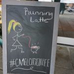 chalkboard with girl and coffee on it saying "Running Latte"