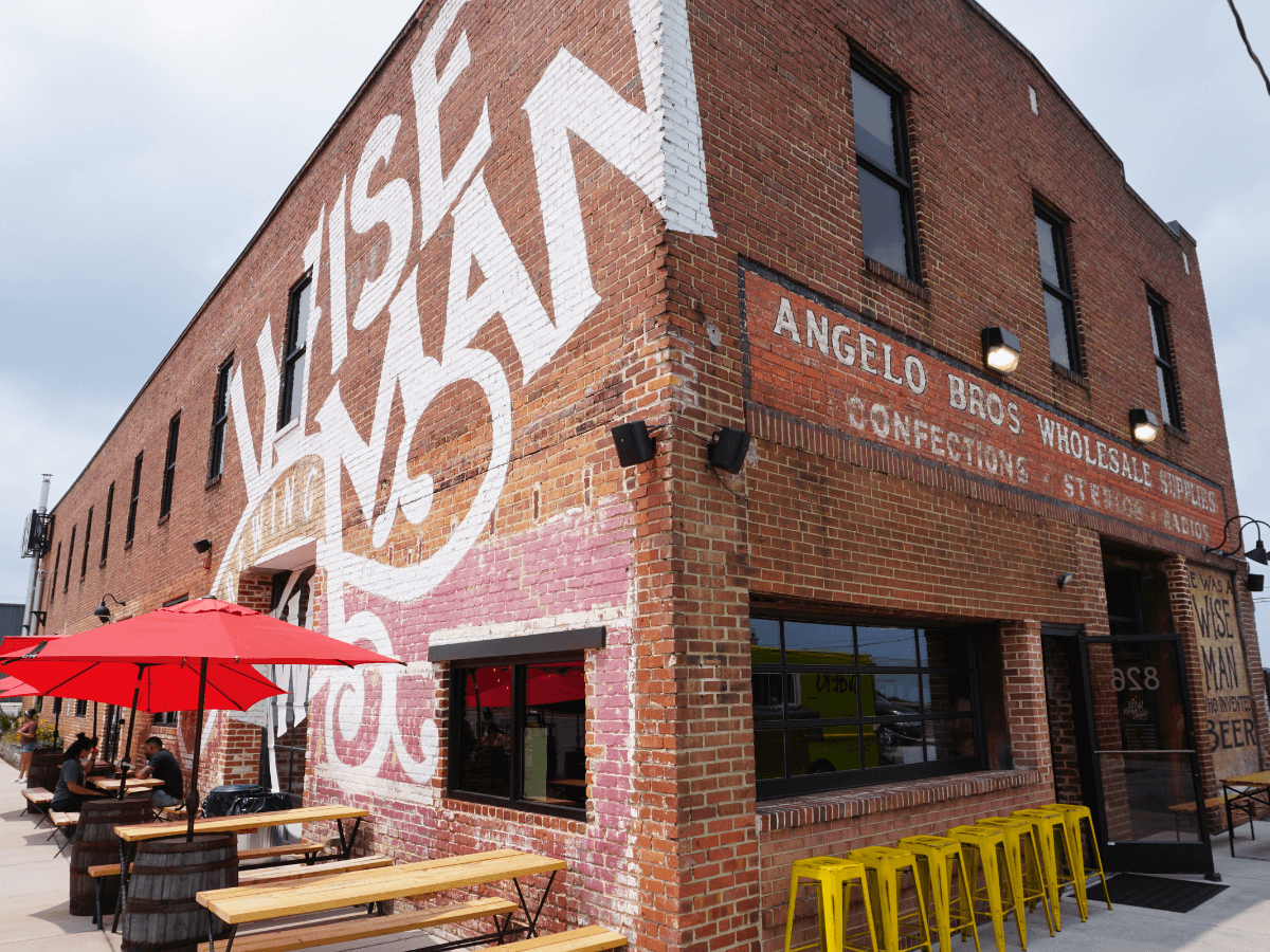 Brick building with Wise Man logo