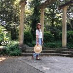 woman in front of pillars