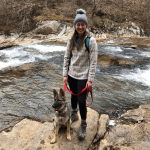 girl hiking with dog