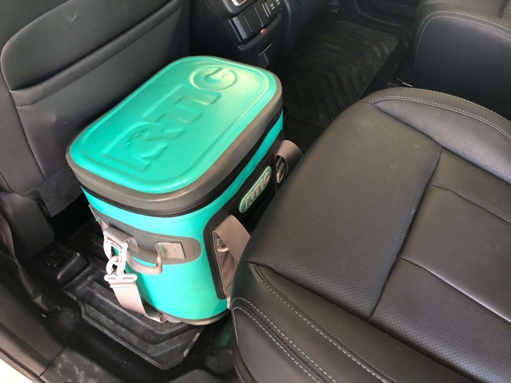RTIC Soft cooler in the back of an SUV - Turquoise and gray