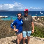 man and woman in front of ocean