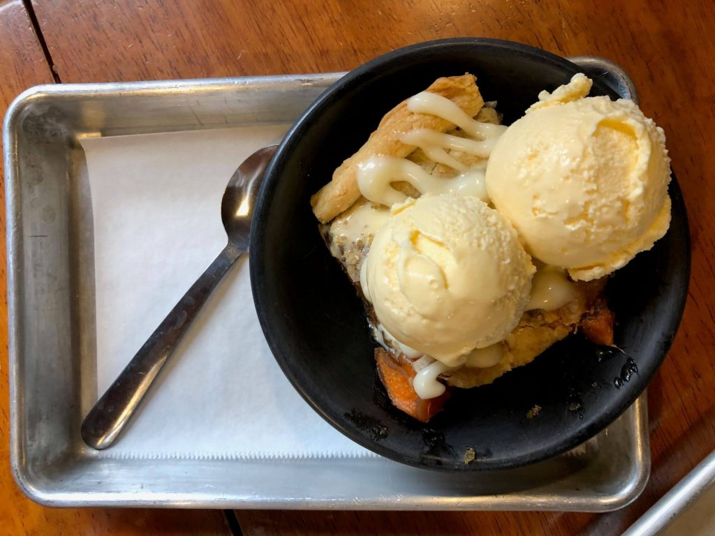 Sweet potato sonker. Sweet potatoes topped with butter crust and 2 scoops of ice cream.