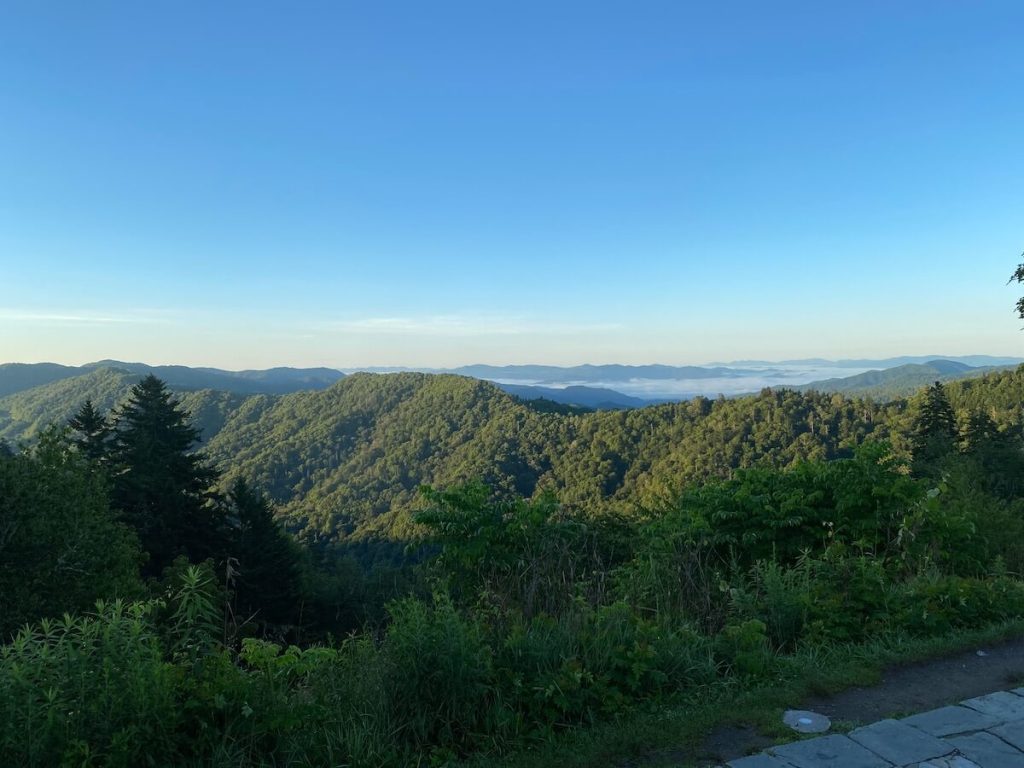smoke hanging low over the mountains in one of the southeastern states