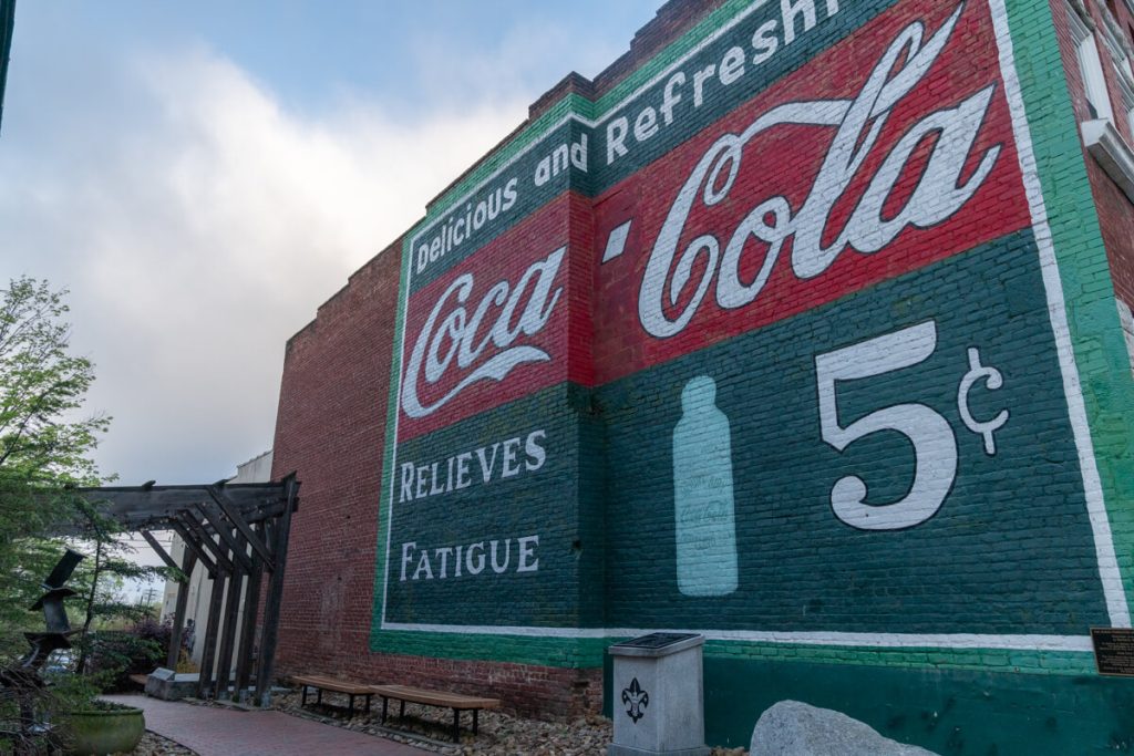 Coca-Cola mural in an alleyway.