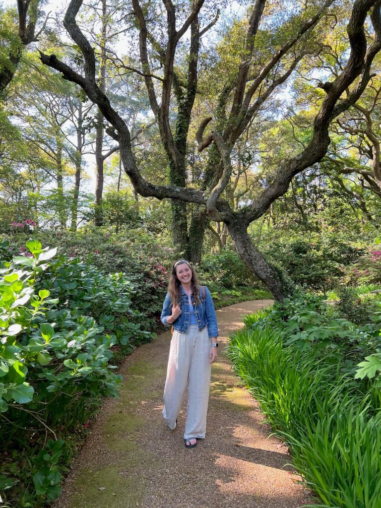 girl on a path through botanical gardens