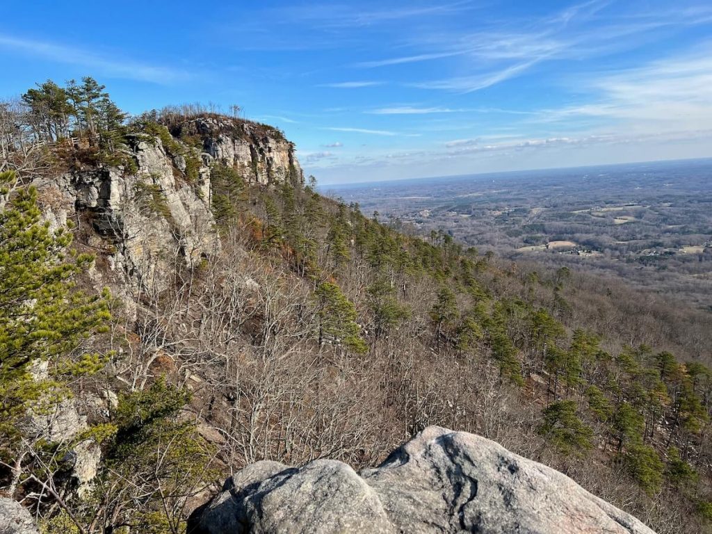 Pilot knob in the distance with the piedmont in the background at Pilot Mountain State Park, one of the best day trips from Mount Airy.
