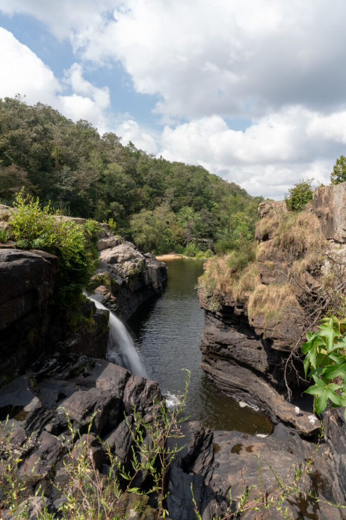 Waterfall between two rocky outcroppings.