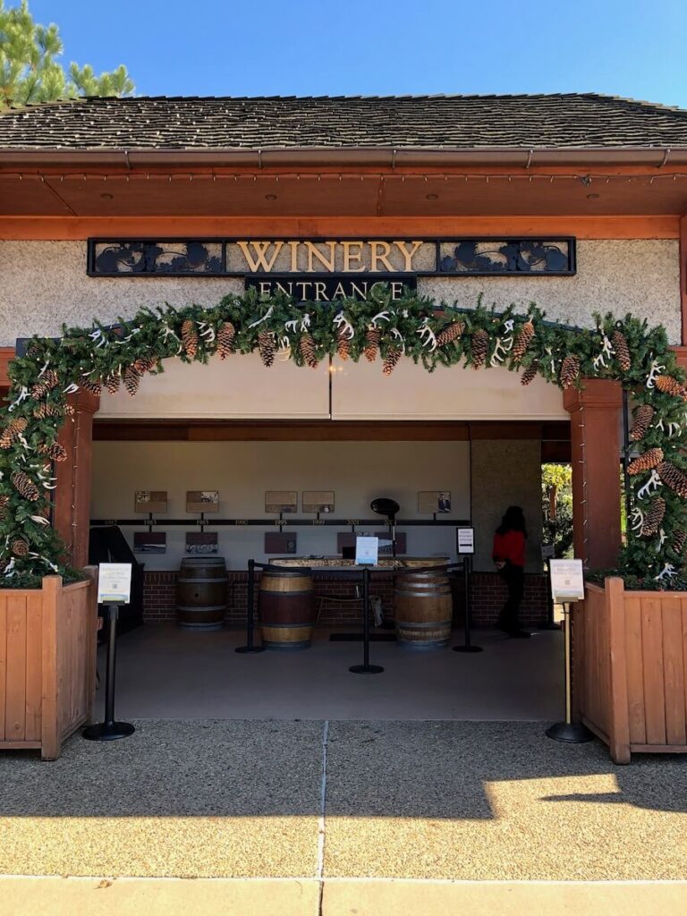 Winery Entrance sign at Biltmore with Christmas garland around the doorway. It's one of the best wineries in Asheville.