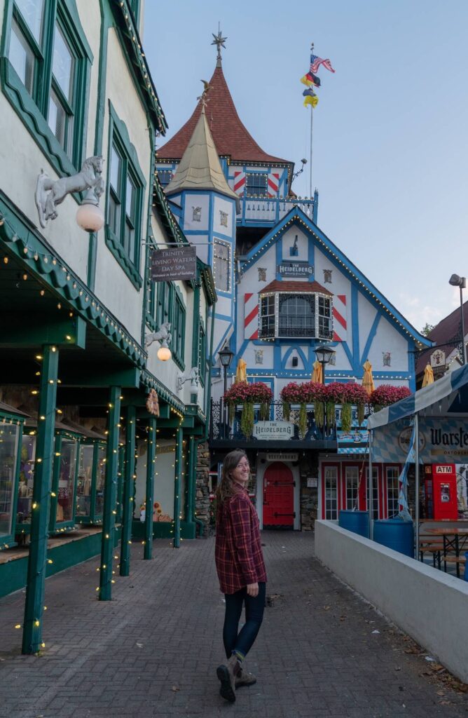 girl standing in front of German-inspired building