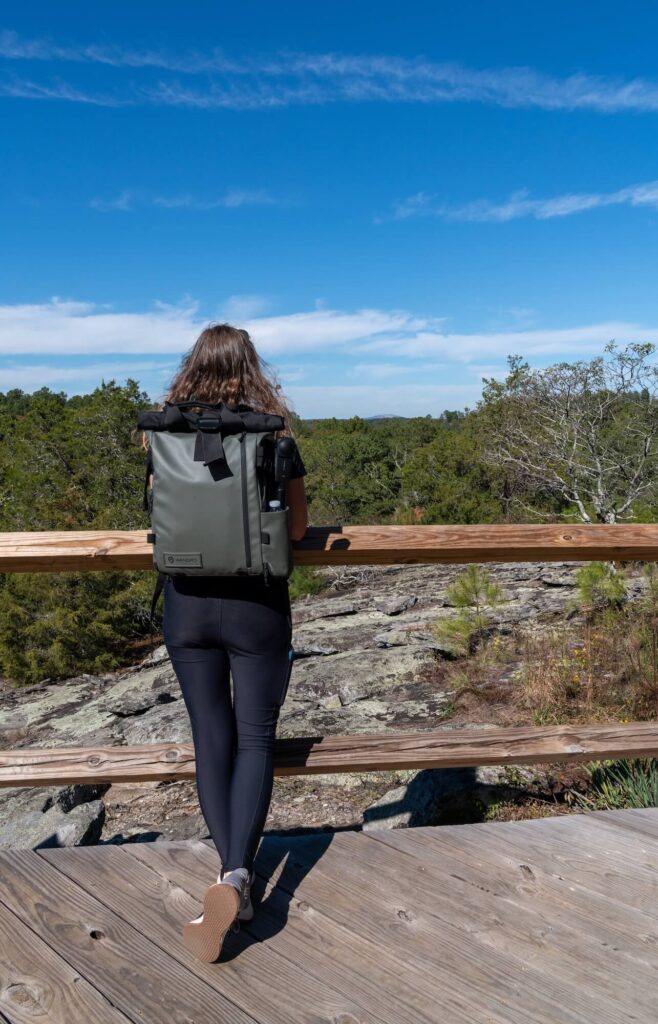 girl looking out over a granite rock face at Panola Mountain State Park