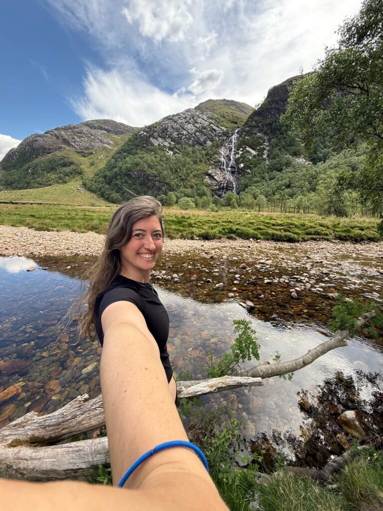 girl in front of waterfall